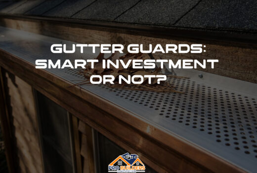 Close-up of a perforated metal gutter guard installed on a residential roof, effectively blocking dry leaves and pine needles from entering the copper gutter system.